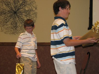 Caleb and Matt Presenting the Gift